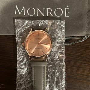 Brand new Monroe watch with gray leather band. Rose gold face